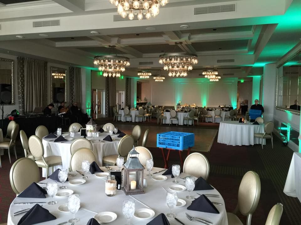 A Large Room with Tables and Chairs Set Up for a Wedding Reception — Pinellas Park, FL — Hyde's Professional DJ & Event Services