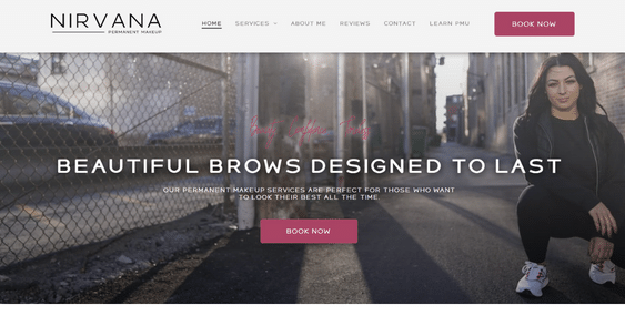A woman is sitting in front of a chain link fence on the nirvana website.