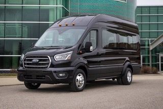 A black mercedes sprinter van is parked on a white background.