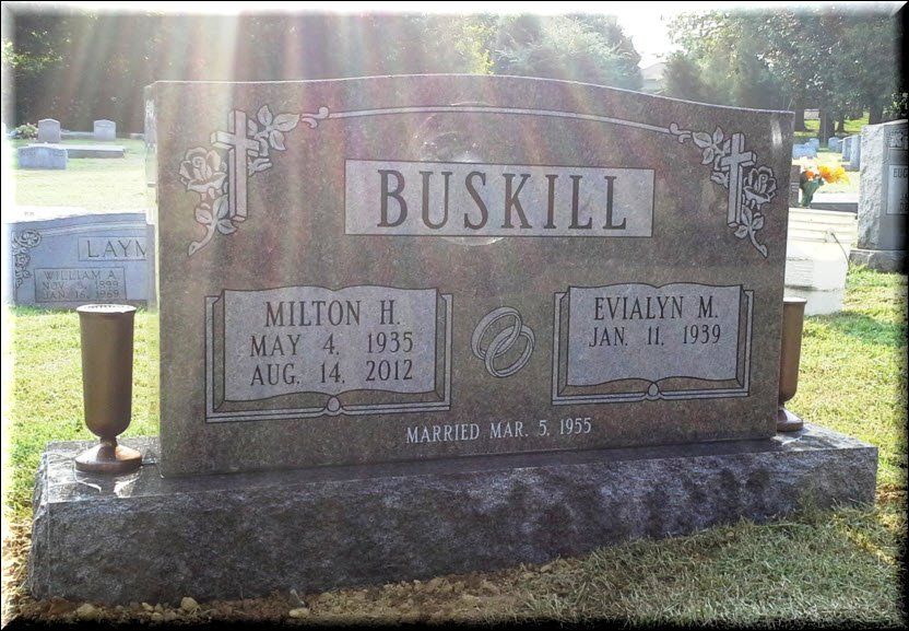 A gravestone in a cemetery with the name buskill written on it