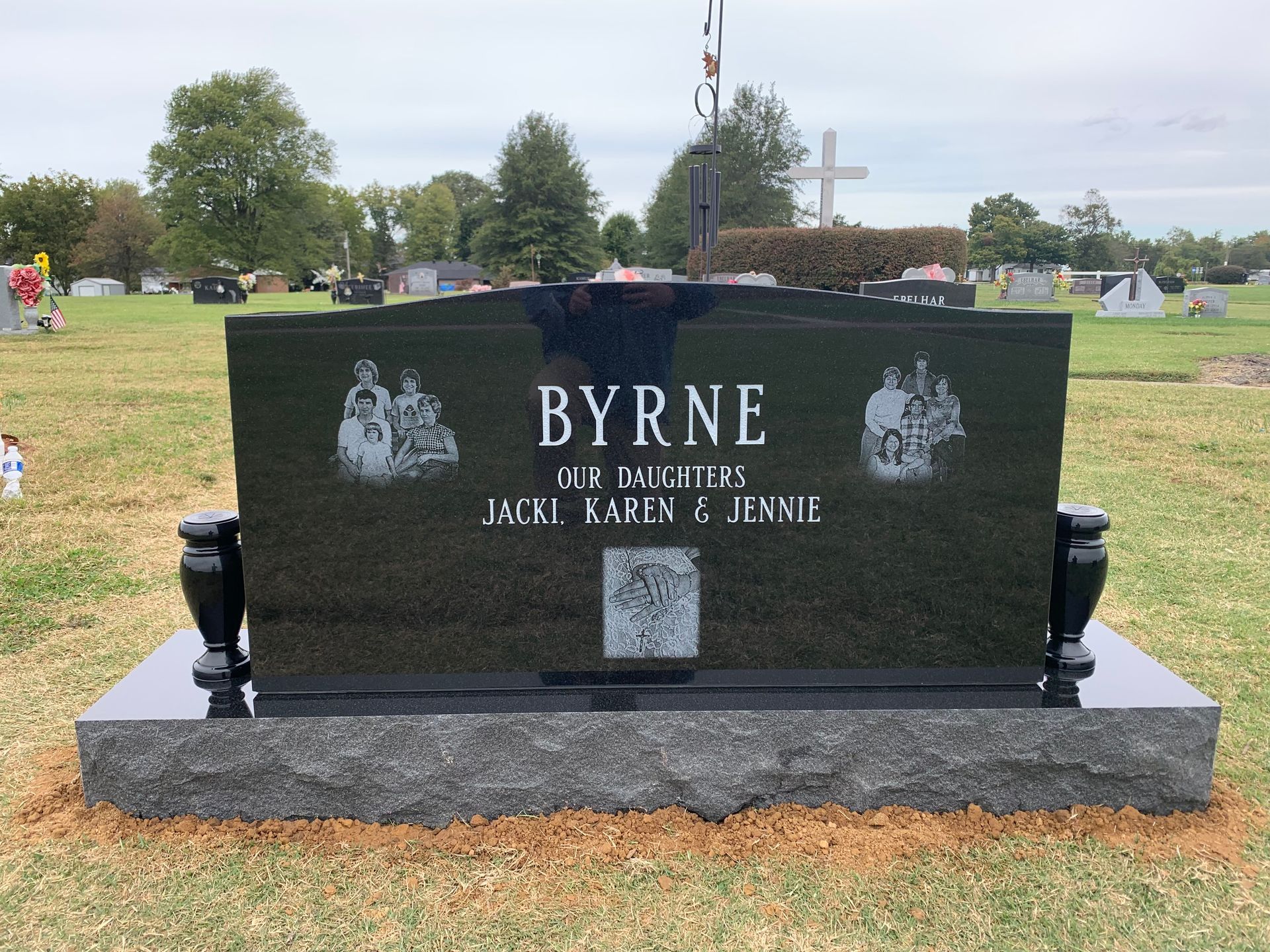 A black gravestone with the name byrne on it