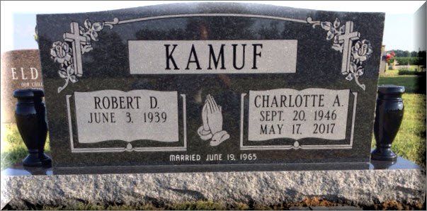 A gravestone for robert d. kamuf and charlotte a.