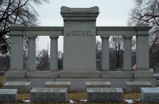 A cemetery with a statue that says mischel on it