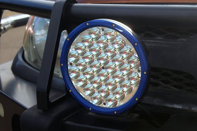 Blue Circular Led Driving Light Mounted On A Vehicle — Coast Mechanical Services in Berkeley Vale, NSW