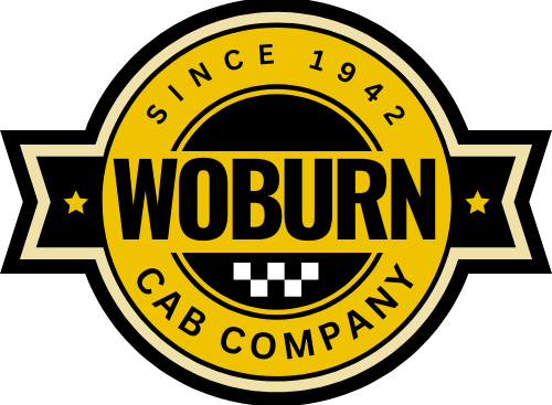 A yellow and black logo for woburn cab company