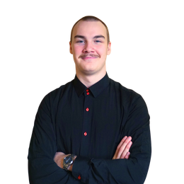 Man in black shirt with arms crossed, smiling, watch on wrist.