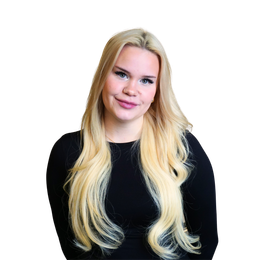 Woman with long, wavy blonde hair, wearing a black long-sleeved shirt, smiling.