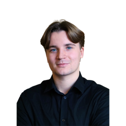 Man with light skin and light brown hair smiling, wearing a black button-up shirt.