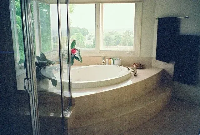 Round bathtub next to potted plants — Hesperia, CA — Bergstrom Construction