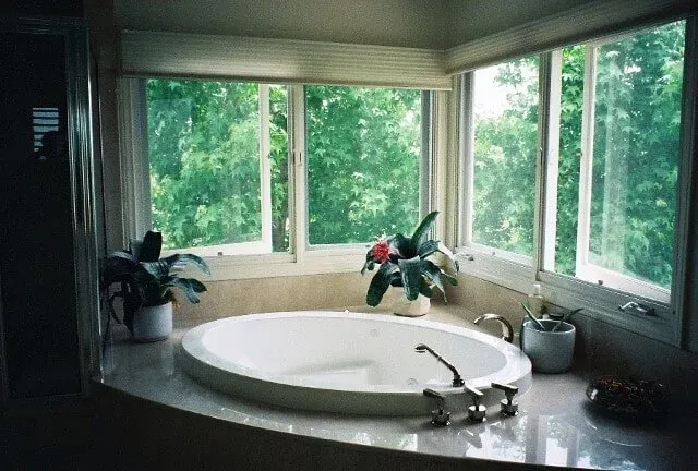 Bathtub with potted plants around it — Hesperia, CA — Bergstrom Construction