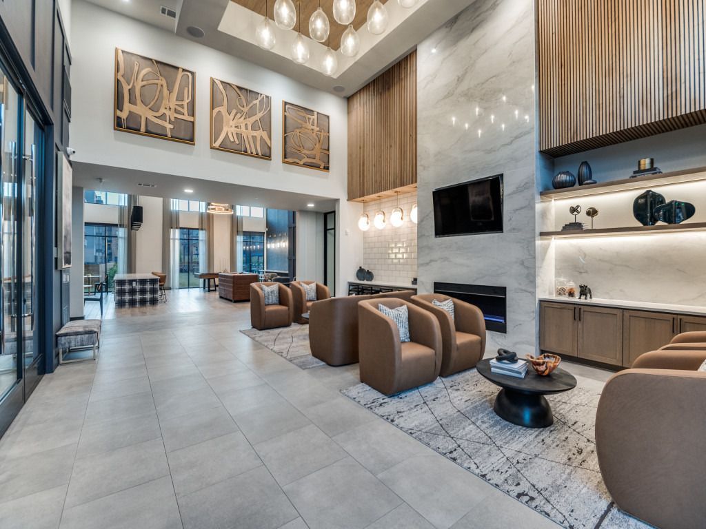 A living room filled with furniture and a fireplace.
