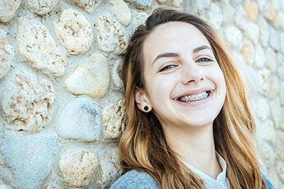 Beautiful smiling girl with braces - Dental Work in Fort Myers, FL