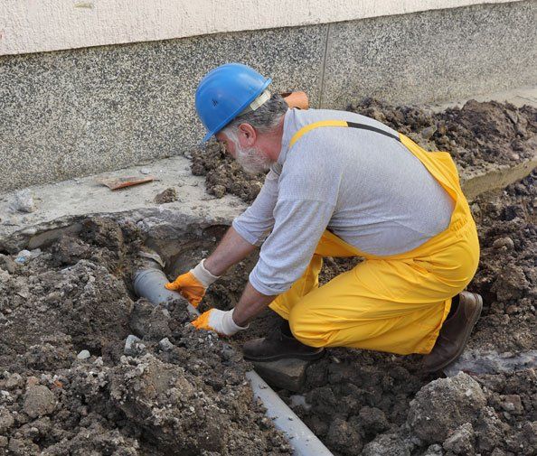 Plumber doing septic service — New Build Plumbing in the Whitsundays Cannonmvale, QLD