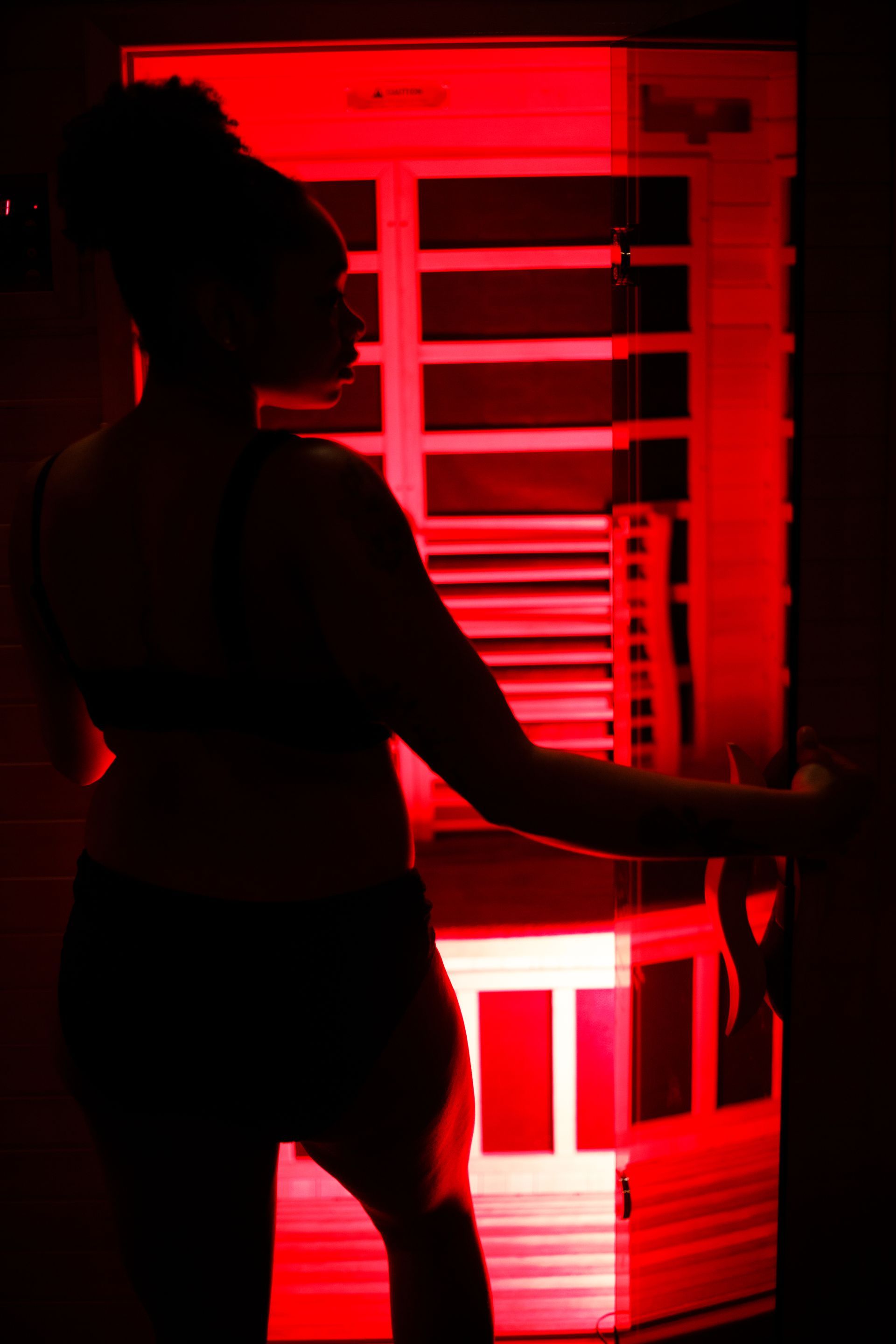 A woman enters the Infrared Sauna