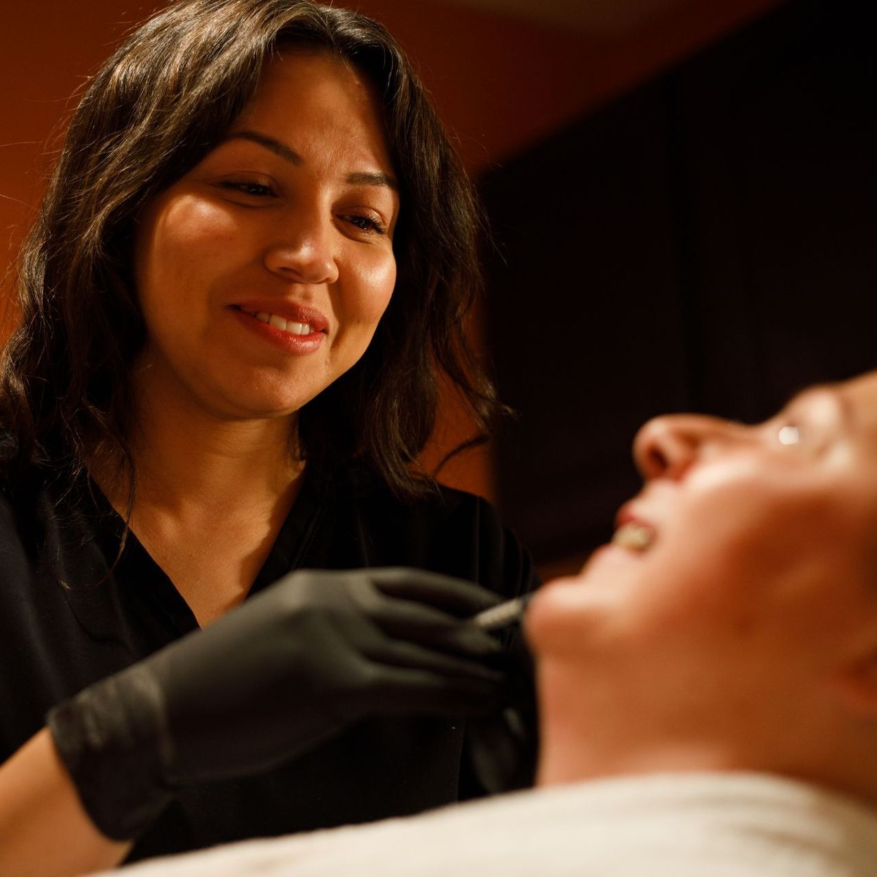 A woman receiving a Lumecca treatment