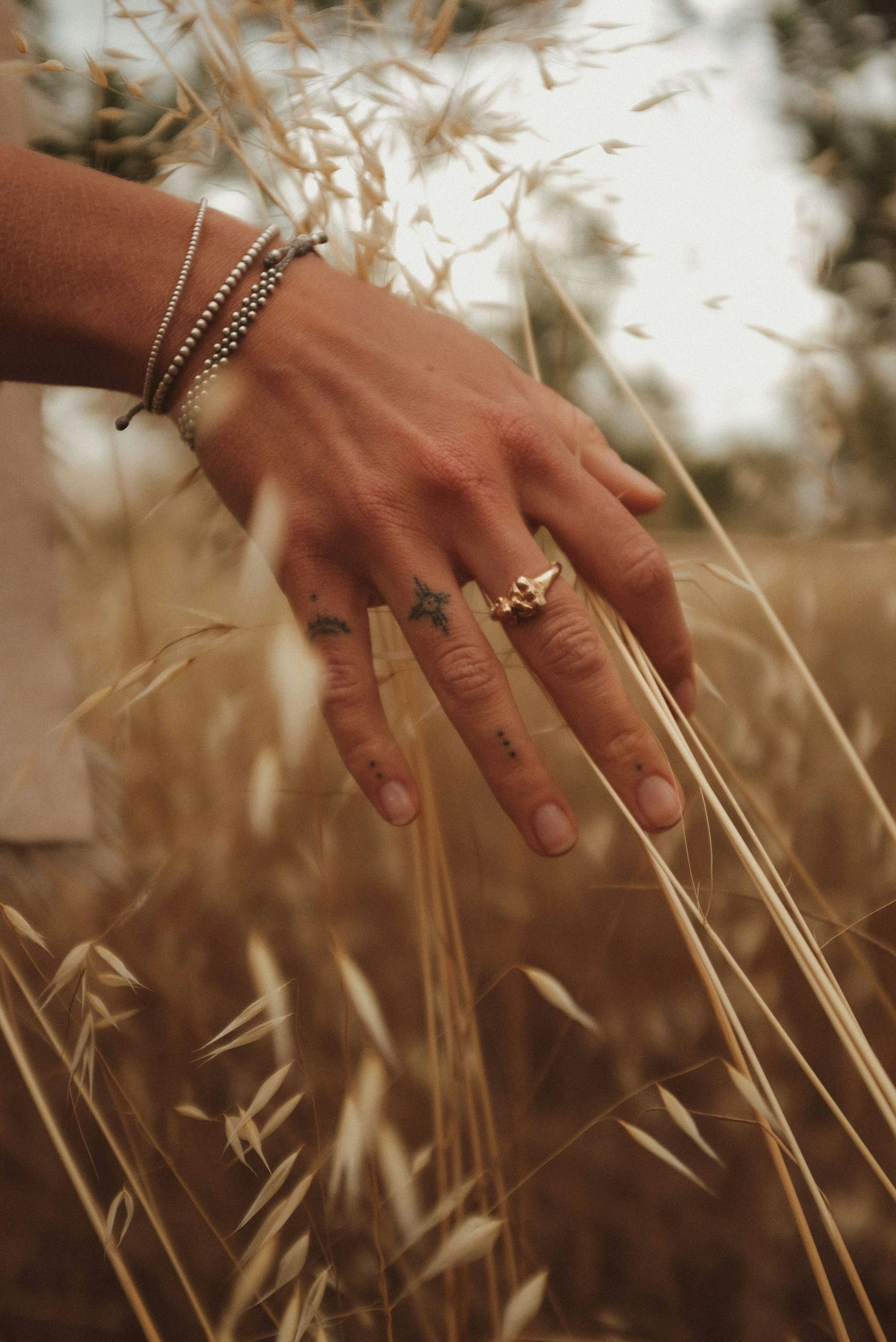Image of girl's hand in wheat