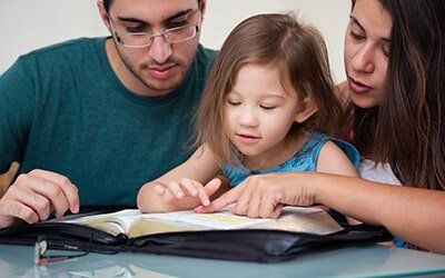 Family Law — A Family Reading A Book in Bowling Green, OH