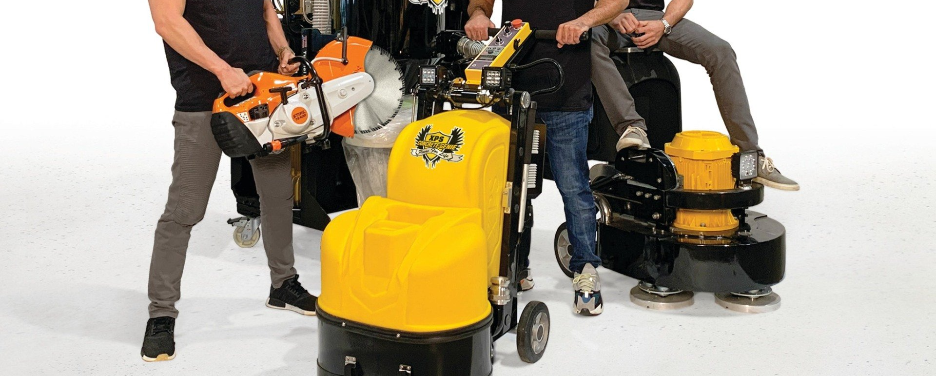 Men holding construction equipment, posing on a white background.