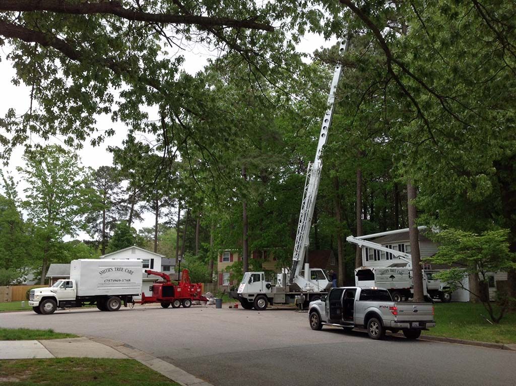 A white truck is parked on the side of the road