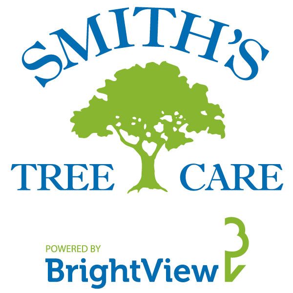 The logo for smith 's tree care is powered by brightview