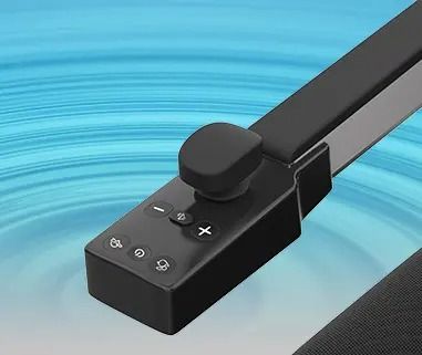 Black control panel with joystick and buttons, angled against a blue, blurred background.