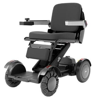 Black and gray folding power wheelchair with seat, armrests, and foot platform, designed for mobility assistance.