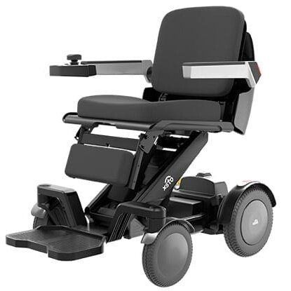 Black, foldable electric wheelchair with seat, armrests, and footrest.