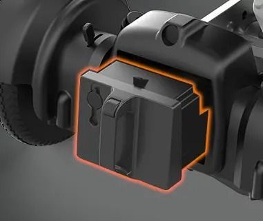 Black differential lock on a vehicle axle, highlighted in orange.