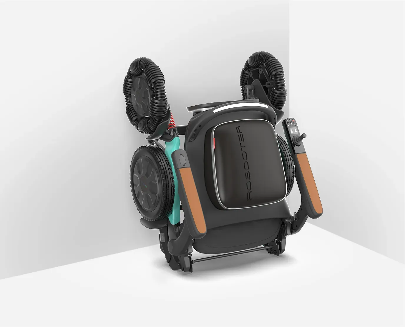 Folded teal and black baby stroller leaning against a white corner.