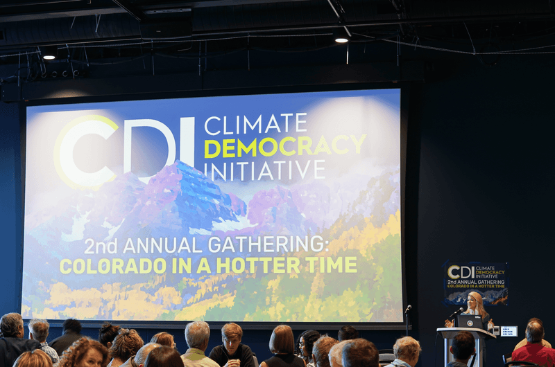 A projection screen displays 