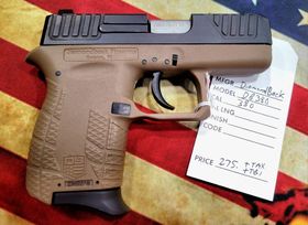 A tan and black Diamondback DB380 handgun sits on an American flag fabric with a price tag attached.