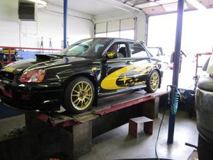 Subaru sports car on hoist