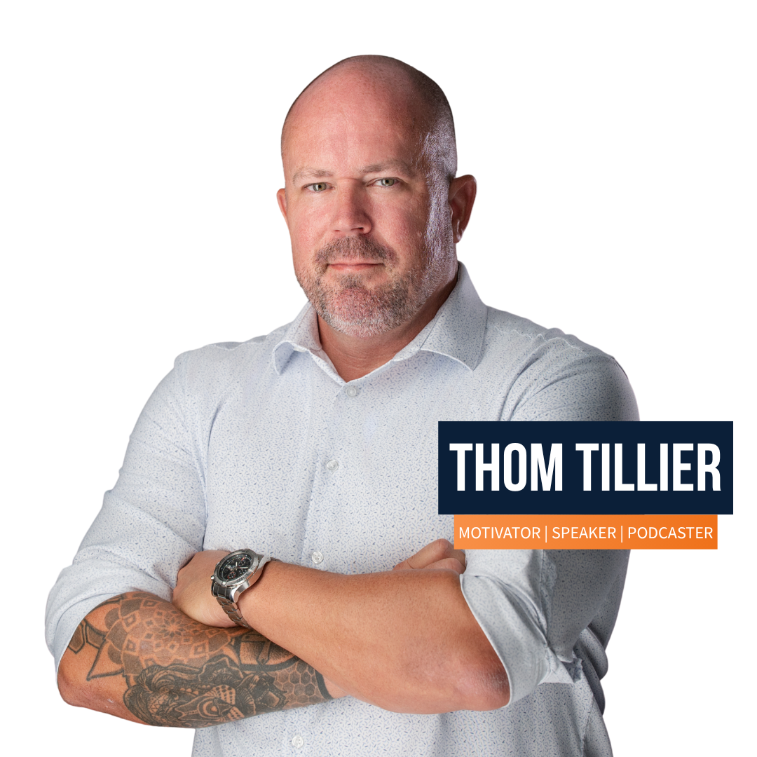 A man named Thom Tillier is standing with his arms crossed A man named Thom Tillier is standing with his arms crossed