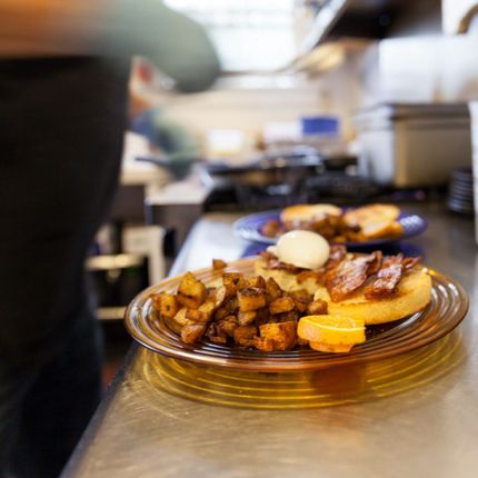 A plate of food sits on a counter in a kitchen