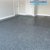 Gray speckled epoxy floor in a garage with white walls.