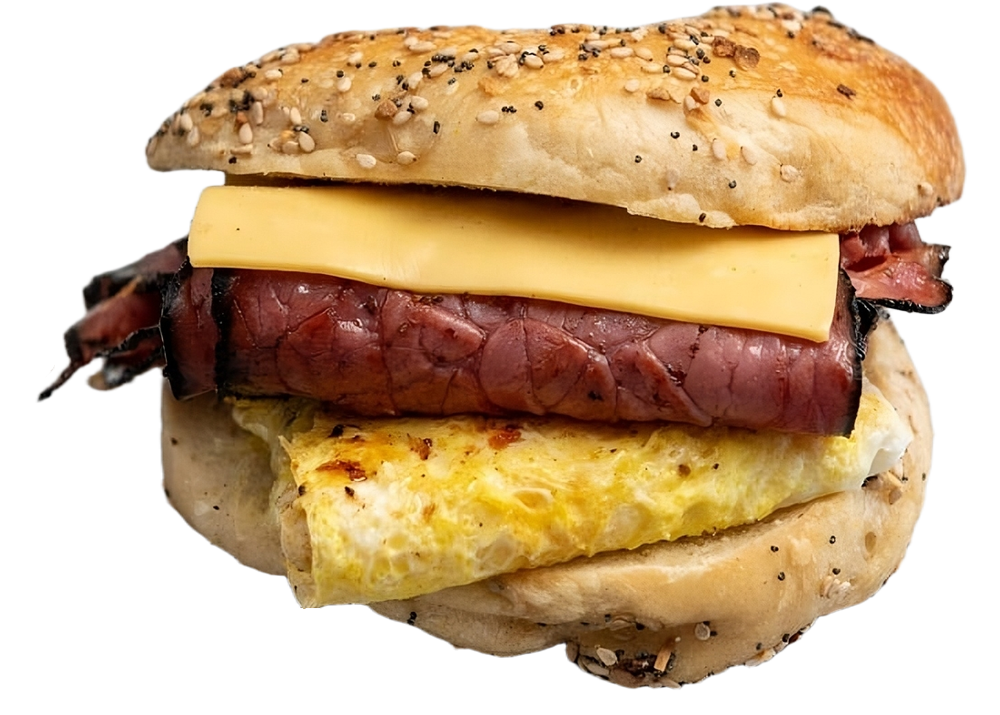 A bagel sandwich with meat and cheese on a white background