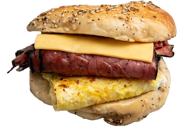 A bagel sandwich with meat and cheese on a white background