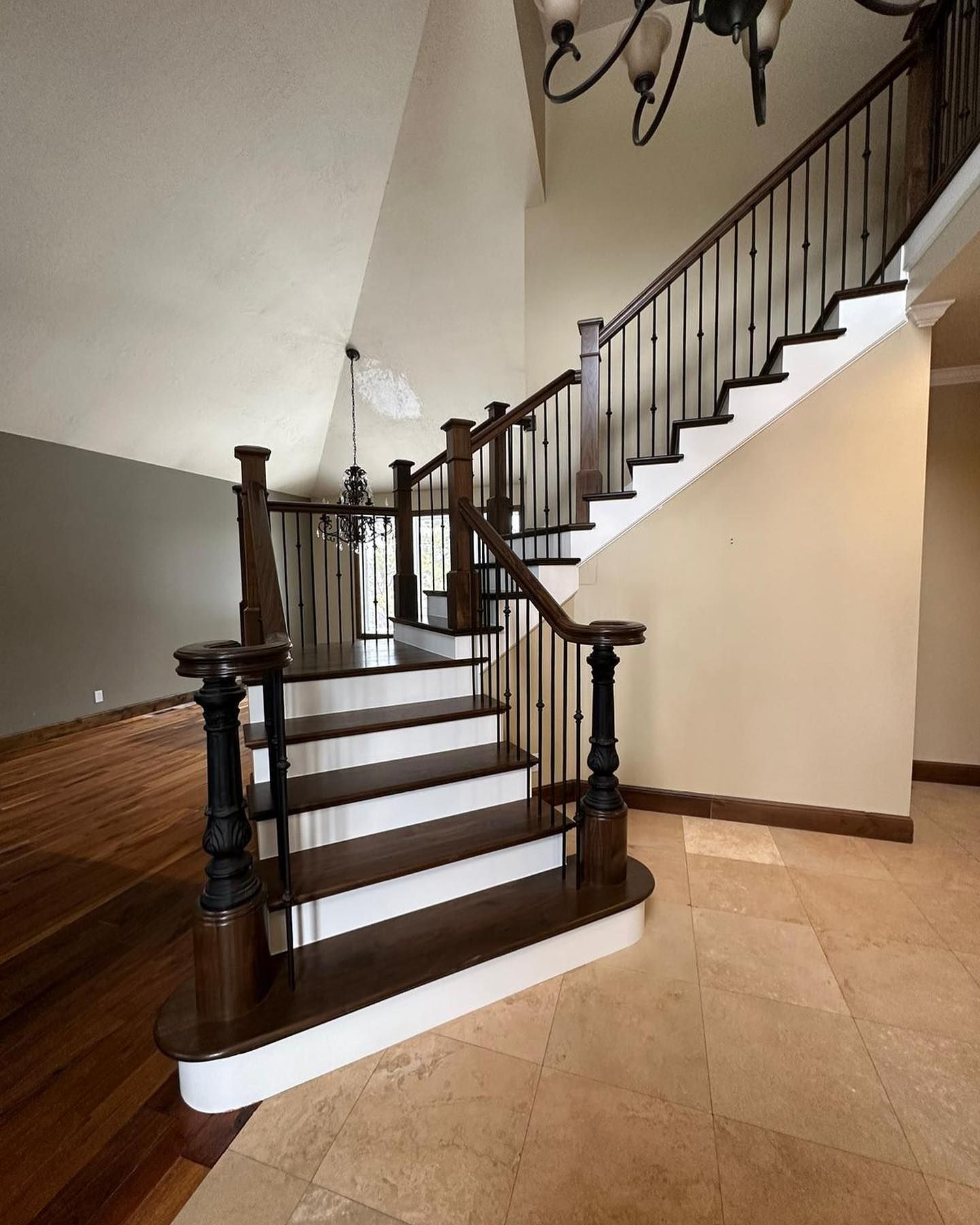 A staircase with a wooden railing and white steps