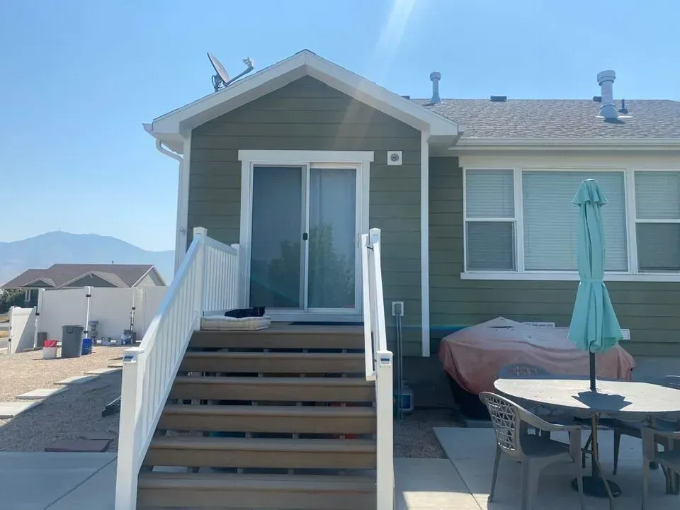 A kitchen with blue cabinets and white counter tops