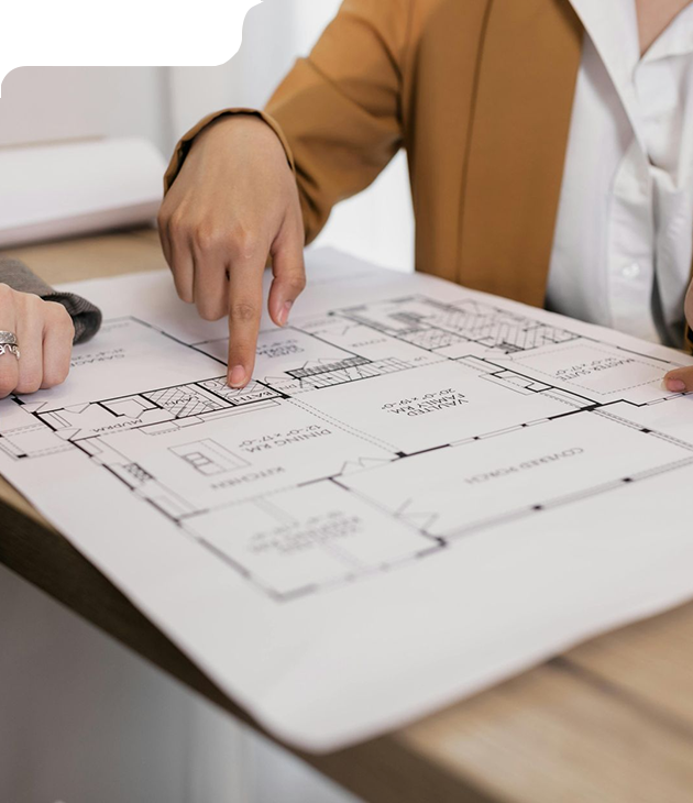 Person pointing at a blueprint, discussing a home's floor plan.