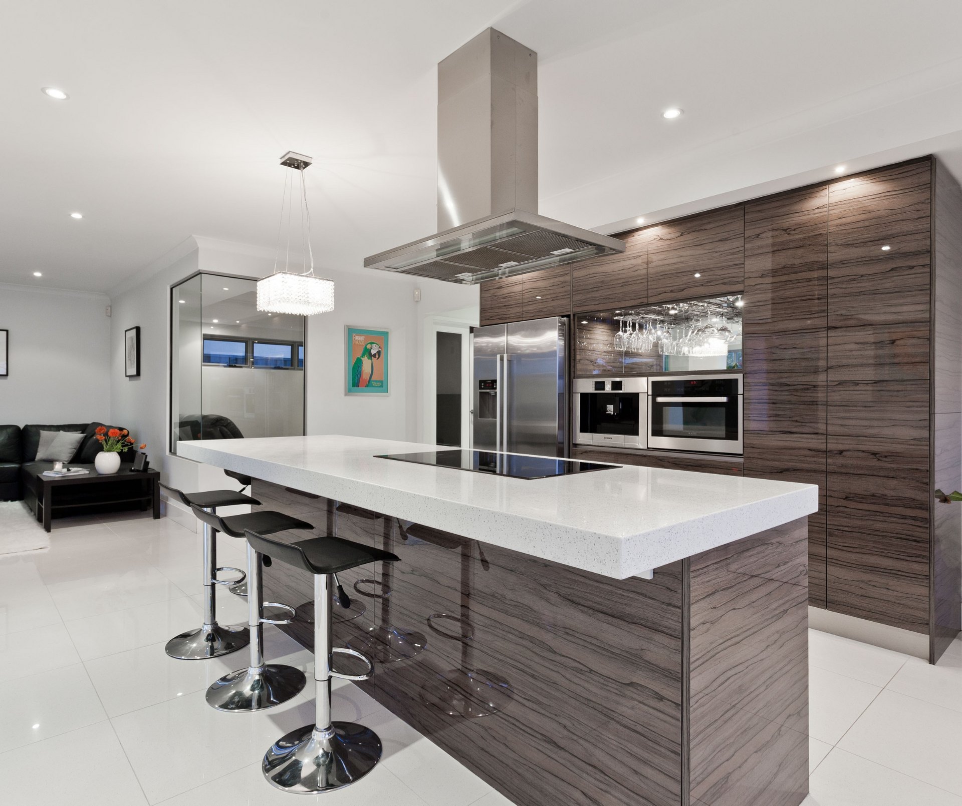 A kitchen with a large island and stools