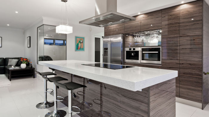 A kitchen with stainless steel appliances and wooden cabinets