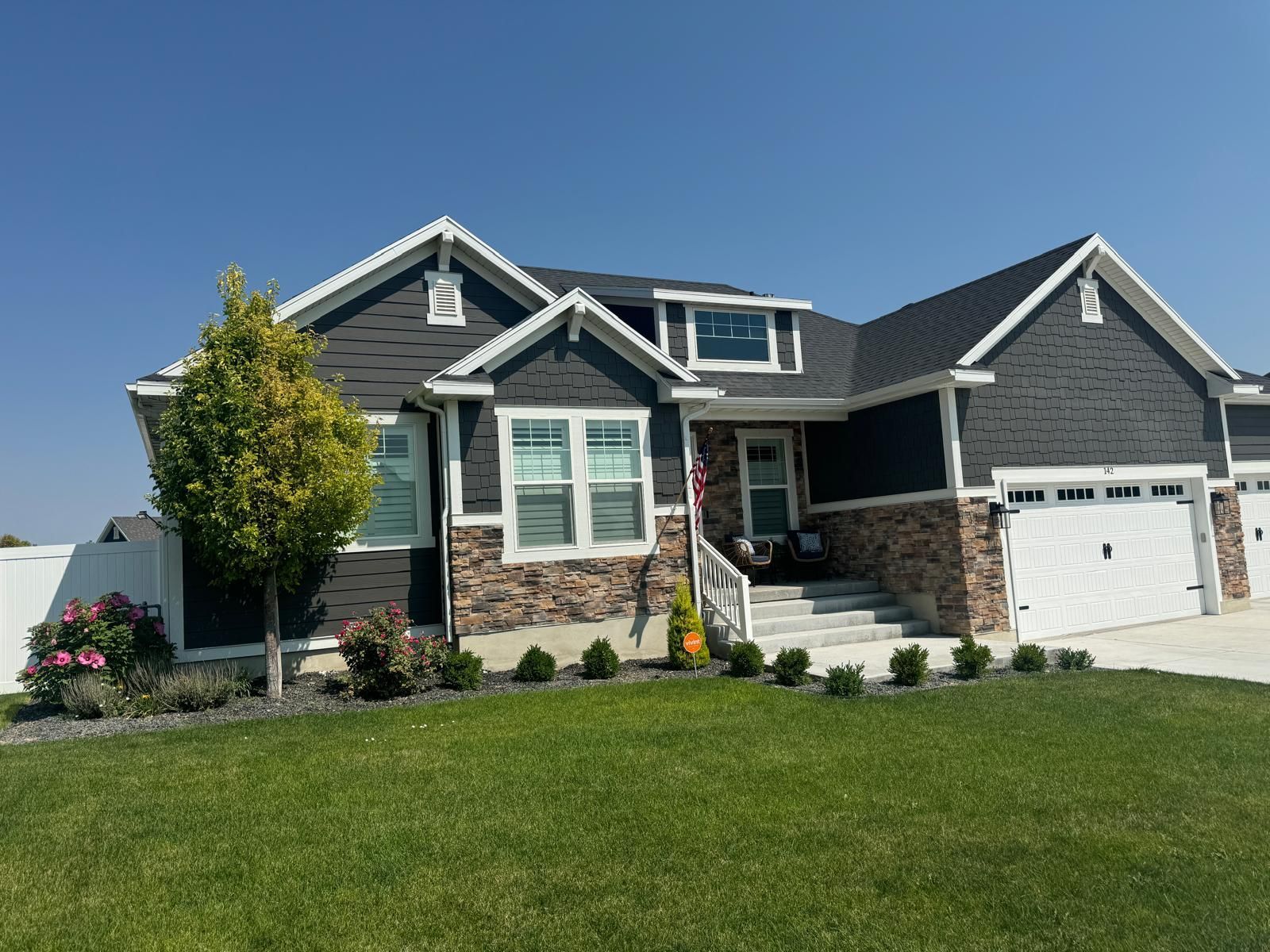 A kitchen with white cabinets and stainless steel appliances.