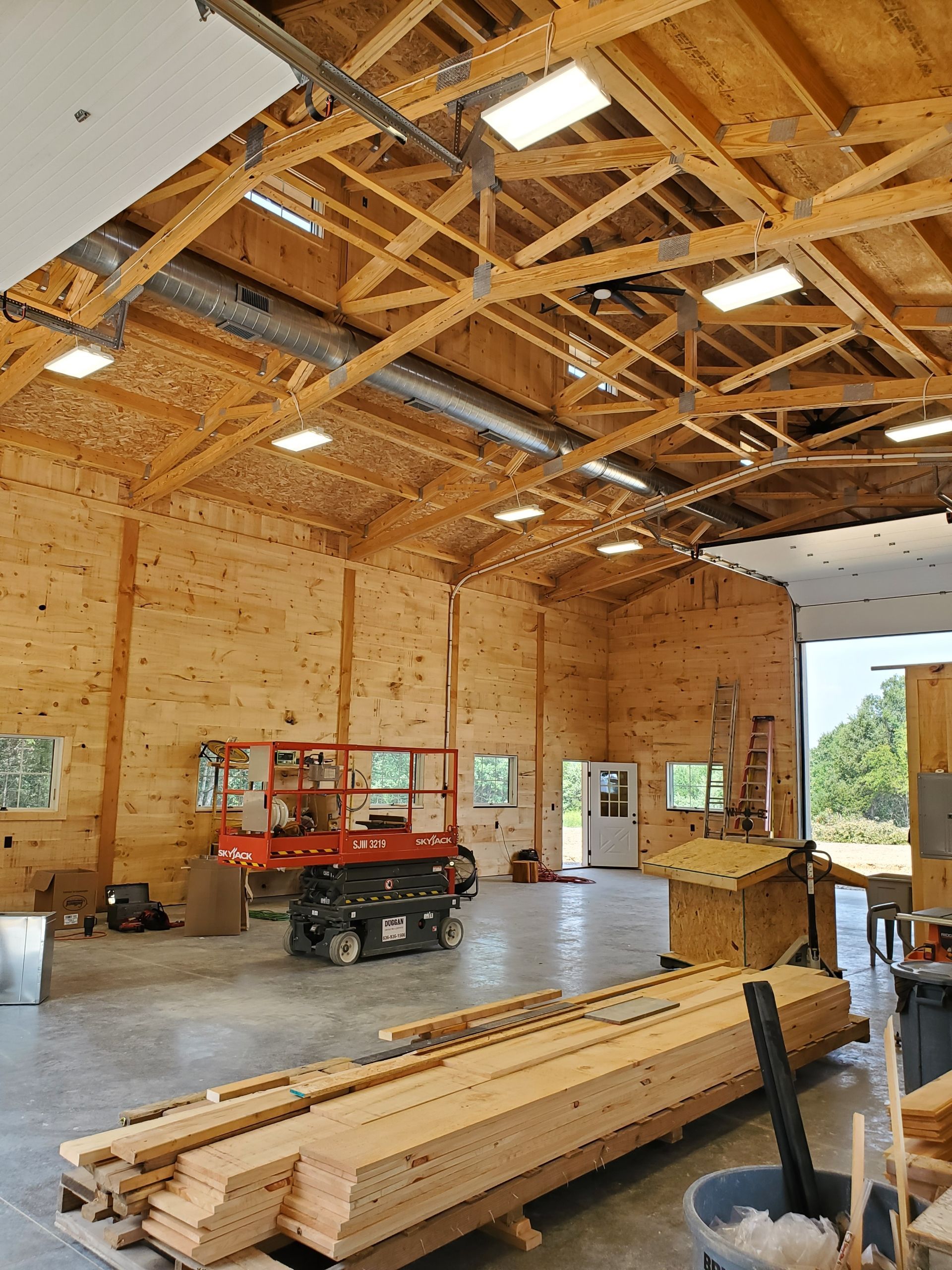 A large wooden building with a lot of wood in it