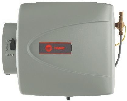 A humidifier is sitting on a white surface.