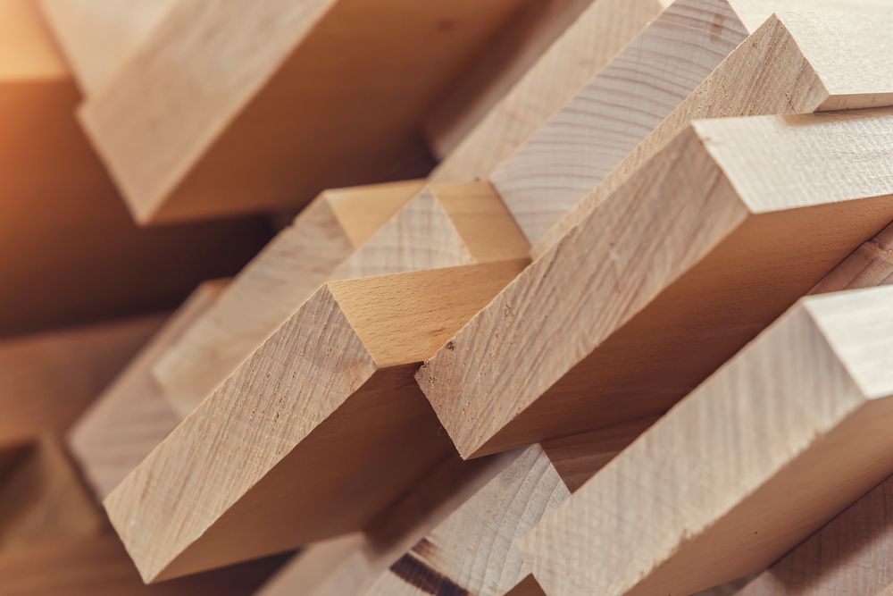A close up of a pile of wooden blocks stacked on top of each other.