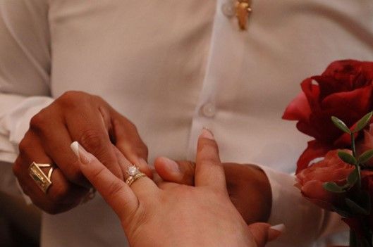 Man is Putting Wedding Ring on Woman's Finger — Las Vegas, NV — A Chapel of Love