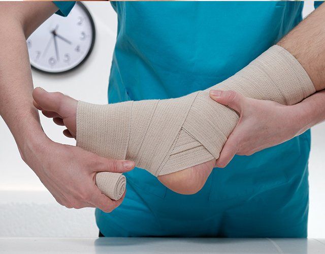 Doctor Treatment to an Injured Foot— Lake Orion, MI — Associated Foot Clinic Of Lake Orion PC