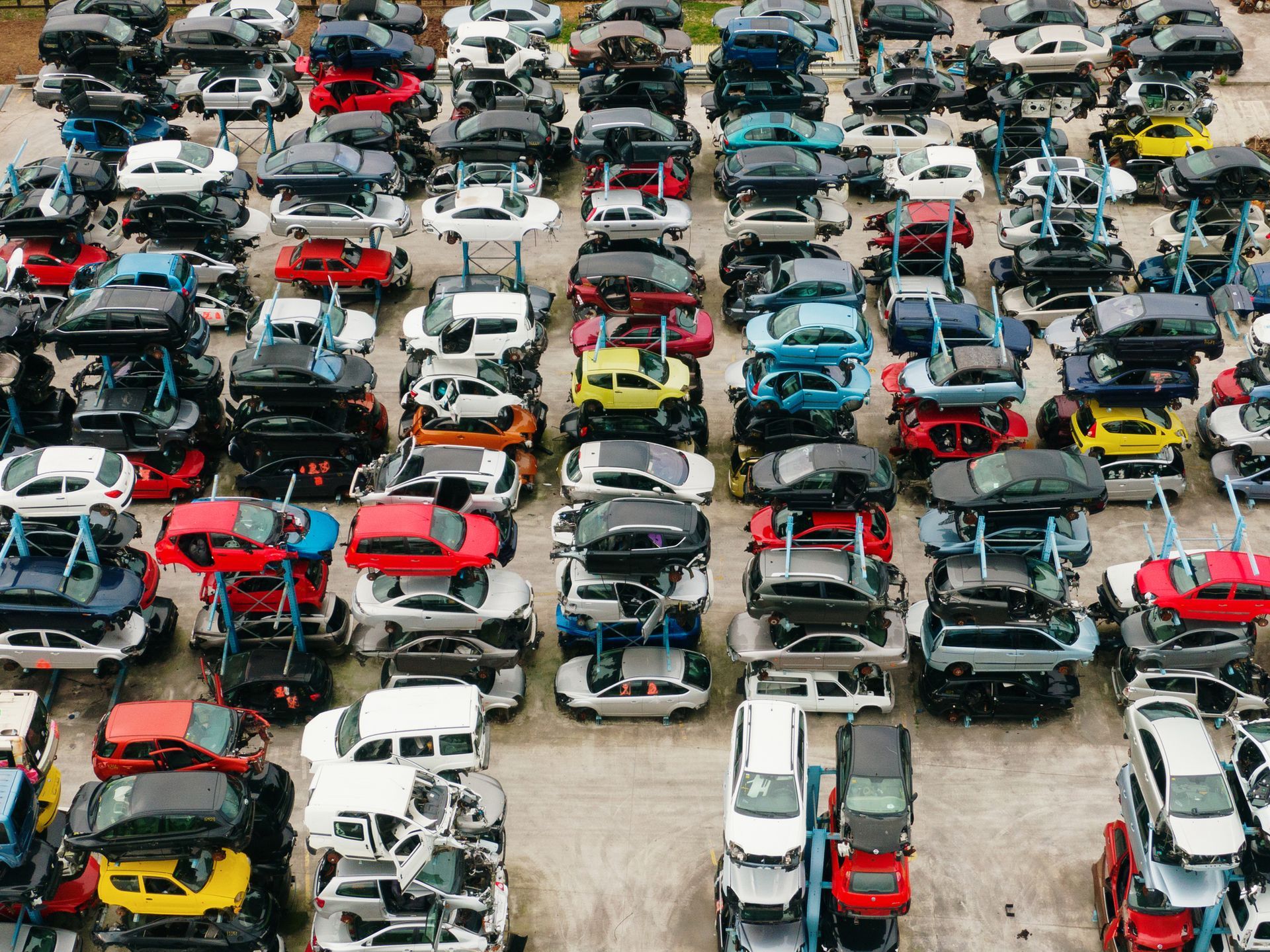 Many scrapped cars stacked as seen from above - Salvage Yard