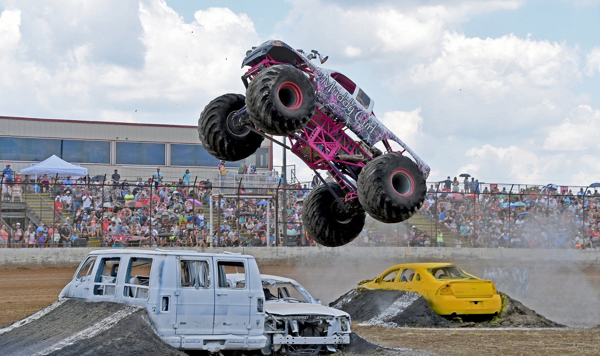 Muddy Girl Monster Truck in the air